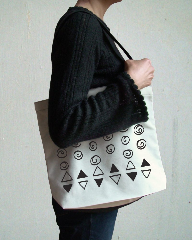 holding tribal tote bag